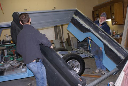 Son helps get the bed off