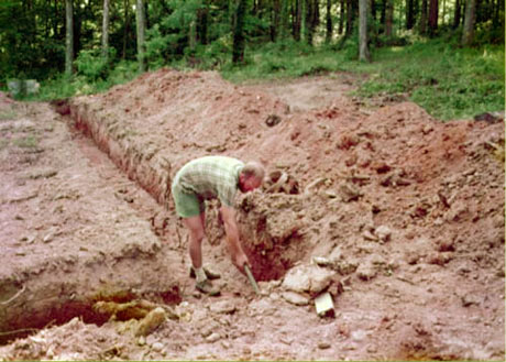 Cleaning up corners where backhoe couldn't get